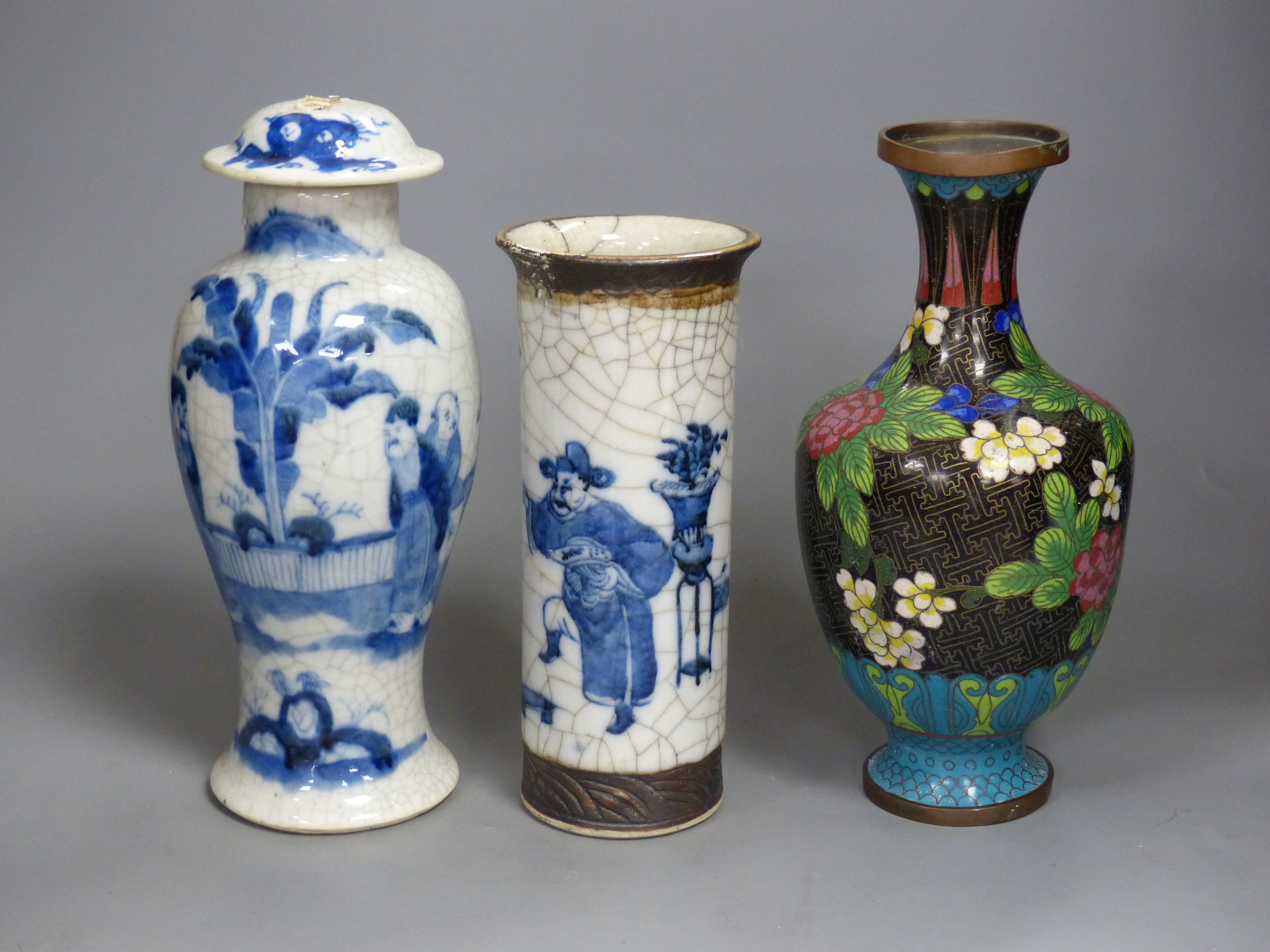 Three Chinese blue and white vases, a cloisonne enamel vase, another vase and a soapstone figure